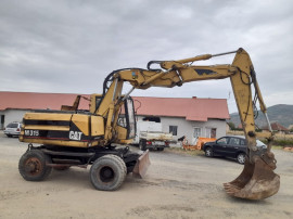 Dezmembrez excavator pe roti Caterpillar M 315