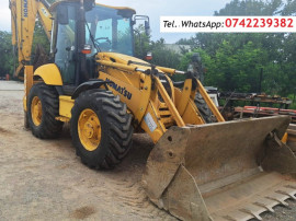 Buldoexcavator Komatsu 93S5, an 2007, cupa multifuncționala, anvelope noi